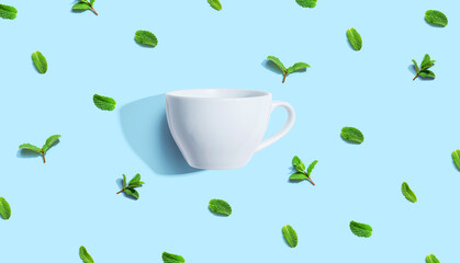 Fresh mints with tea cup overhead view