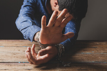 prisoner covers his face