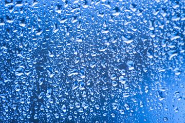 fresh water drops on glass as background
