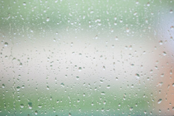 spring raindrops on glass as background