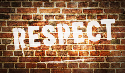 Fototapeta na wymiar Respect spray painted inscription on the brick wall