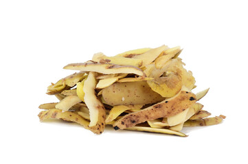 A pile of potato skins with earth and black eyes