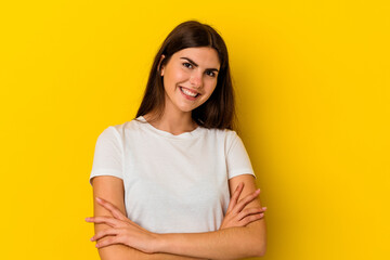 Obraz premium Young caucasian woman isolated on yellow background laughing and having fun.