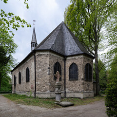 Fototapeta premium The church of St. Mary Magdalene and Lazarus in the Cologne cemetery Melaten from the year 1245