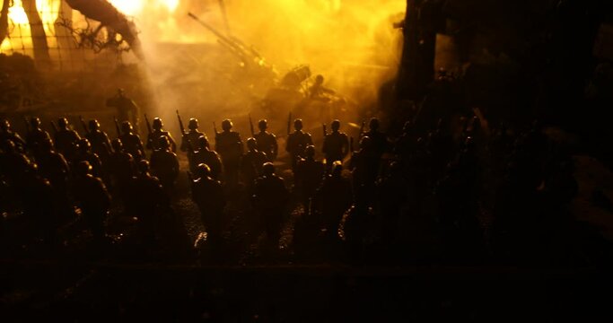 War Concept. Military silhouettes fighting scene on war fog sky background, World War Soldiers Silhouette Below Cloudy Skyline At night. German soldiers in ranks. Selective focus