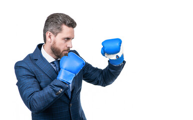 confident businessman man in suit and boxing gloves punching isolated on white copy space, knockout