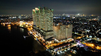 Fototapeta premium Jakarta, Indonesia, May 5, 2021 : Aerial view of Beautiful sunset view to night Jakarta