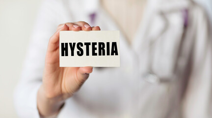 HYSTERIA. Card with text in hand of Medical Doctor.