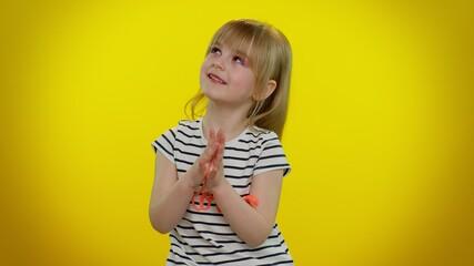 Sneaky cunning playful child girl with tricky face gesticulating and scheming evil plan, thinking...