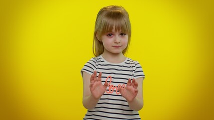 Hey you, be careful. Cute kid child girl 5-6 years old warning with admonishing finger gesture,...