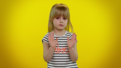 I am not guilty. Portrait of blonde kid child 5-6 years old pointing fingers himself ask say who me no thanks i do not need it. Yellow studio wall background. Teenager children girl lifestyle emotions