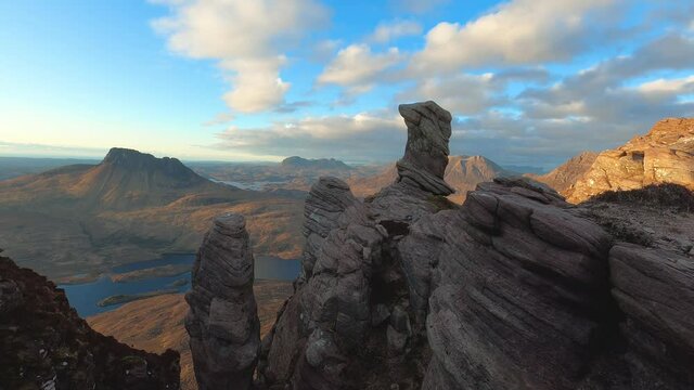Stunning time lapse of cloud movement over Assynt mountains. Taken from sandstone rock pinnacles at summit of Sgorr Tuath looking towards Stac Pollaidh and Suilven. Scottish Highlands, UK.