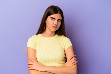 Fototapeta premium Young caucasian woman isolated on purple background who is bored, fatigued and need a relax day.
