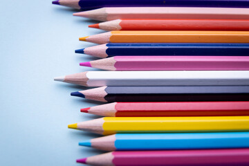 Colorful pencil set on blue background