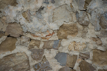 Rustic background or texture of irregular natural stone.