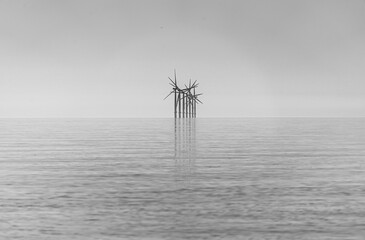 Offshore wind turbines generating renewable electricity and energy off the Essex clacton coast for...