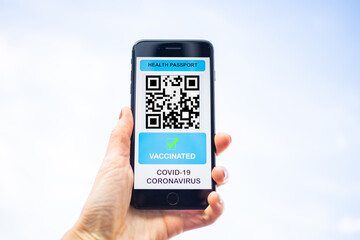 health Vaccine Passport for Coronavirus or Covid-19. Traveller Using Mobile Phone with Vaccination in Immune Status to Certificated International Traveling in Airport