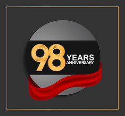98 years anniversary logotype with golden color and red ribbon on black circle with glitter background isolated on black background. can be use for celebration and party