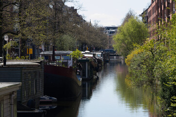 A warm sunny spring day in downtown Amsterdam Holland along the canal system.