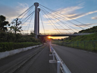 Fototapeta na wymiar Tokyo,Japan-May 5, 2021: Ipponsugi-bashi bridge at sunrise in Tama city, Tokyo, Japan 