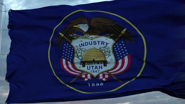 USA and Utah Mixed Flag waving in wind. Utah and USA flag on flagpole