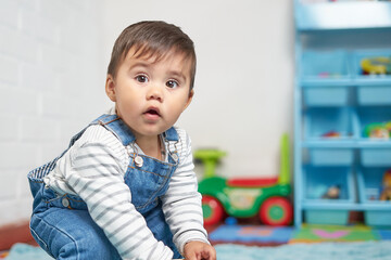 baby playing in house