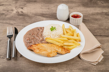 Chicken breast, rice, beans and french fries. Typical brazilian executive dish - obrazy, fototapety, plakaty