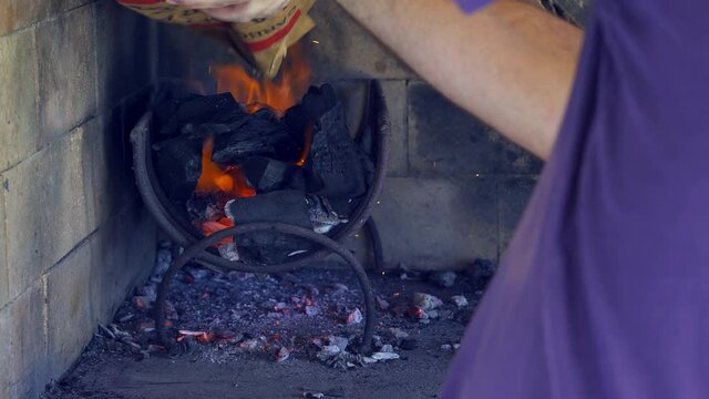 Preparing the fire for an Argentinian asado. Close up.