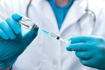 Doctor holding a viol with vaccine against corona virus.