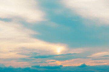 Naklejka na ściany i meble Hazy cloudy sky . The sun is hiding behind the clouds