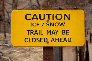 Ice and Snow Caution Sign At Trailhead