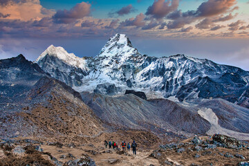 Awe inspiring peak of Ama Dablam - trekkers in the foreground, Himalayas, Nepal © Shawn