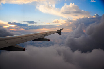 Fototapeta premium Sunset view from the window of a flying plane. Colombia.