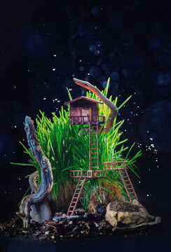 Miniature treehouse in tall grass with driftwood, forest adventures, children book cover