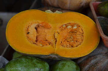 Pumpkin fruit that has been split orange..