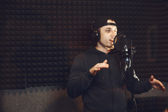 Singing and working in a studio with a microphone