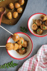 Delicious homemade popular Hong kong street food / Hong Kong Curry Fishball / Made from fresh Spanish Mackerel fish paste, formed into round fishball, deep fried, cooked in thick curry gravy
