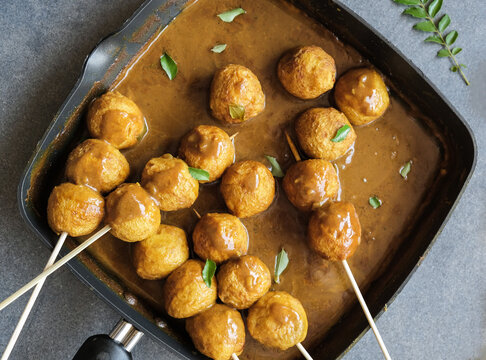 Delicious homemade popular Hong kong street food / Hong Kong Curry Fishball / Made from fresh Spanish Mackerel fish paste, formed into round fishball, deep fried, cooked in thick curry gravy