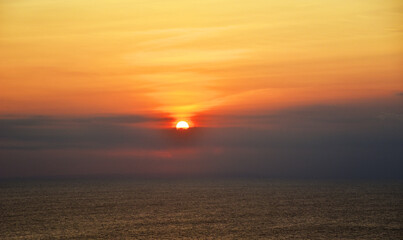 Fototapeta premium Beautiful sunset over the horizon with red ,orange sky color
