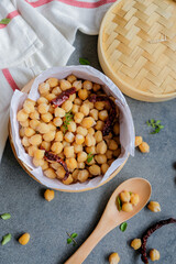 Popular homemade healthy snacks / Steamed Chickpeas with Dried Chili and Curry Leaves / Steamed to perfection, soft and tender, with a tinge of spiciness and curry leaf fragrant, add salt to taste
