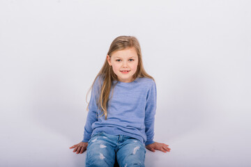 Portrait of beautiful little girl happy smiling on studio. Isolated white background