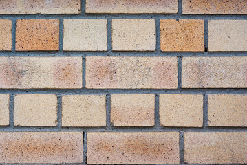 Light pastel yellow brick wall close up background