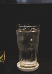 Drinking water with ice in glass