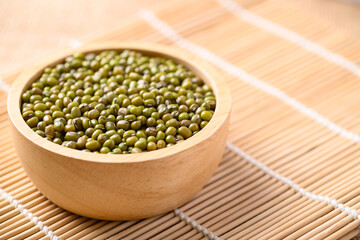 Mung bean seeds in a wooden bowl, Food ingredients in Asian cuisine and produce mung bean sprout