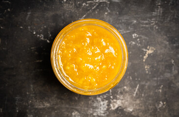 Obraz na płótnie Canvas Jar with freshly making citrus jam. Selective focus. Shallow depth of field.