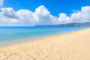 Sea and beach with blue sky on a sunny day.