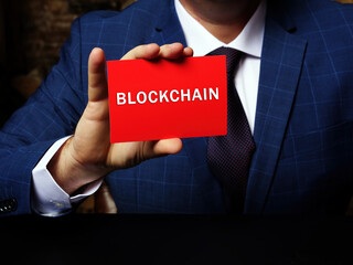 Business concept about BLOCKCHAIN with sign on the page. Business photo shows a digital record of transactions