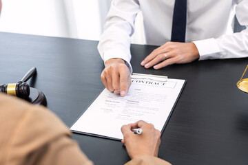 lawyer or judge meeting with client consulting help discussing contract paper agreement.