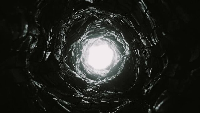 Dark Scary Stone Tunnel. Light at the end of the round cave. Looped video.