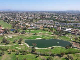 Fototapeta na wymiar Aerial view of golf surrounded by villas and condos with golf in Carlsbad, North County San Diego, California, USA.